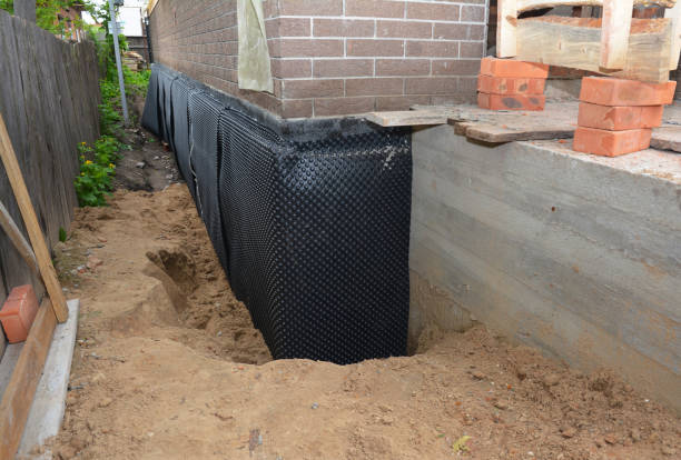 Happy homeowners after waterproofing job in Milroy